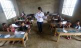 Giang Thi May teaches a first grade class at the primary school of Van Chai in Dong Van district, on the border with China, north of Hanoi, Vietnam. (Kham/Reuters)